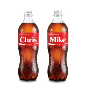 Coca-Cola bottles personalized with the names Chris and Mike.