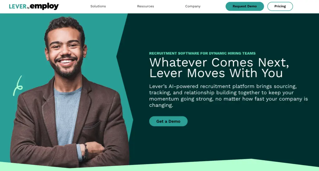 Portrait of a smiling man in a suit promoting Lever's recruitment software.